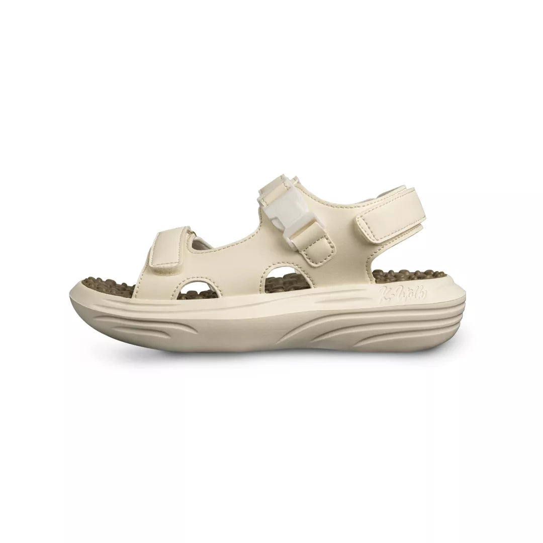 Beige sandal with strap on a white background