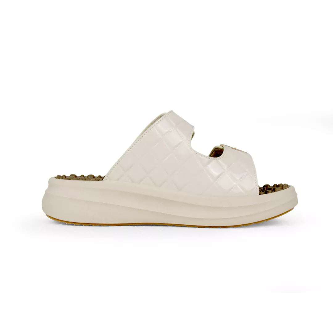 White sandal with a brown sole on a white background