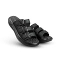 Pair of black sandals with multiple straps on a white background